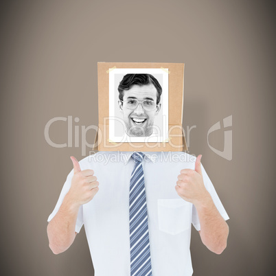 Composite image of businessman with photo box on head