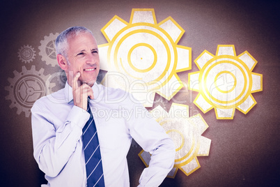 Composite image of businessman thinking