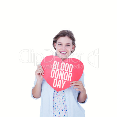 Composite image of woman holding heart card