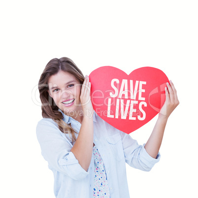 Composite image of woman holding heart card