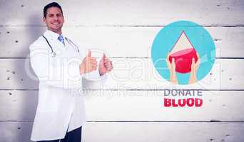 Composite image of handsome doctor showing thumbs up