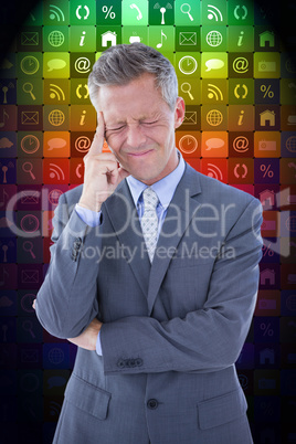 Composite image of businessman with headache