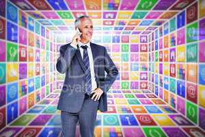 Composite image of businessman on the phone