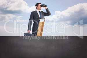 Composite image of businessman looking on a ladder