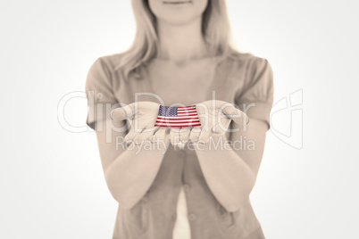 Composite image of happy blonde holding our her hands