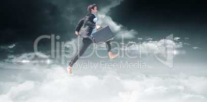 Composite image of leaping businessman
