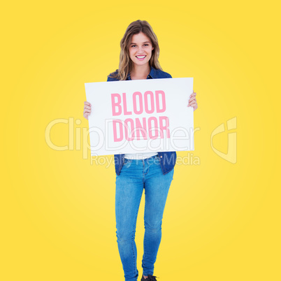 Composite image of woman holding poster