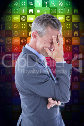 Composite image of businessman with headache