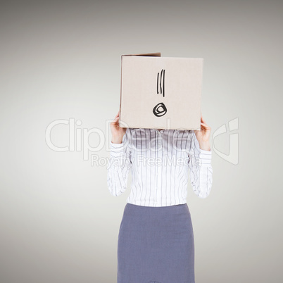 Composite image of businesswoman with box over head