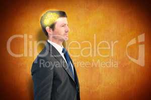 Composite image of handsome businessman looking away