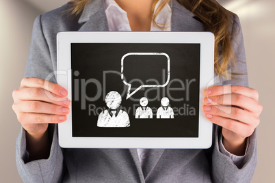 Composite image of businesswoman showing tablet