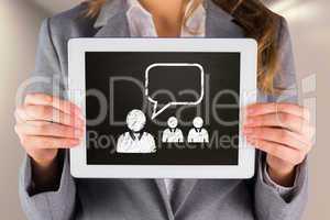 Composite image of businesswoman showing tablet