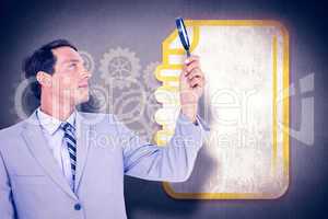 Composite image of concentrated businessman using magnifying gla