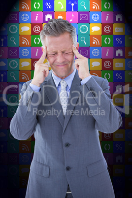 Composite image of businessman with headache