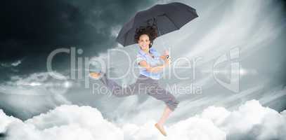 Composite image of happy classy businesswoman jumping while hold