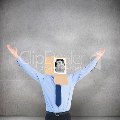 Composite image of businessman with photo box on head