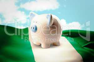 Composite image of piggy bank