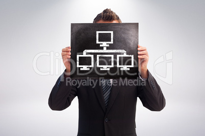 Composite image of businessman showing board