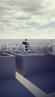 Composite image of businessman looking on a ladder