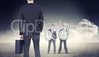 Composite image of businessman standing with his briefcase