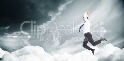 Composite image of jumping businessman