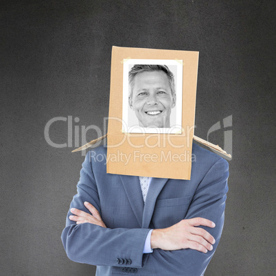 Composite image of businessman with photo box on head