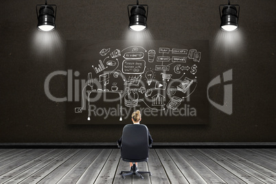 Composite image of businesswoman sitting on swivel chair