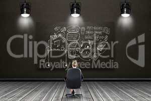 Composite image of businesswoman sitting on swivel chair