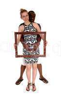 Pregnant couple with picture frame.