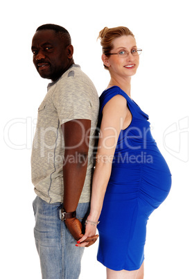 Pregnant couple back to back.