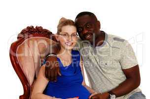 Happy mixed race pregnant couple.