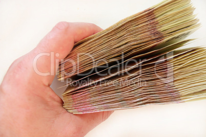 Ukrainian money of value 100 in the hand isolated