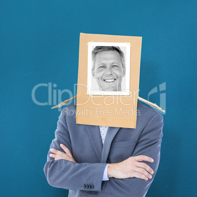 Composite image of businessman with photo box on head