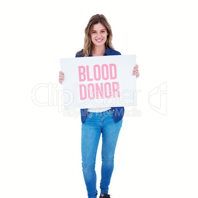 Composite image of woman holding poster