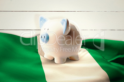 Composite image of piggy bank