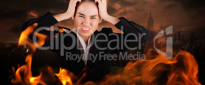 Composite image of stressed businesswoman with hands on her head