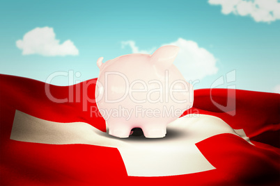 Composite image of piggy bank