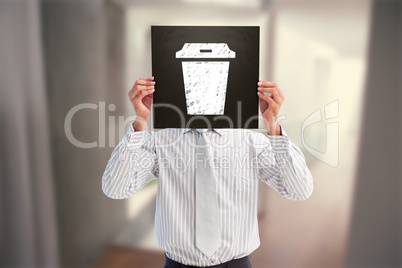 Composite image of businessman showing board