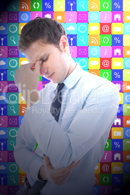 Composite image of businessman with a headache