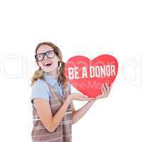 Composite image of geeky hipster woman holding heart card
