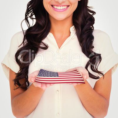 Composite image of pretty brunette holding out hands