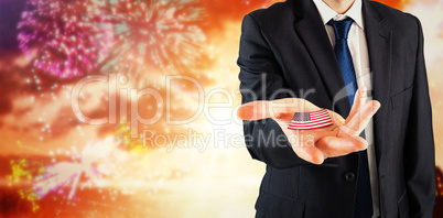 Composite image of mature businessman holding his hands out