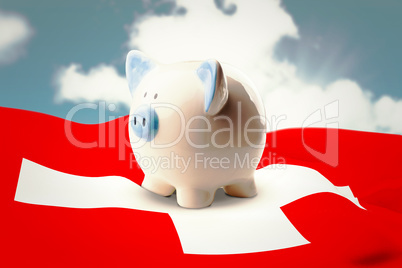 Composite image of piggy bank