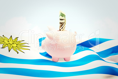 Composite image of dollar in piggy bank