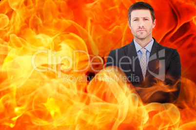 Composite image of businessman looking at the camera