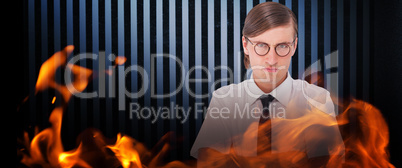 Composite image of geeky businessman looking at camera with arms