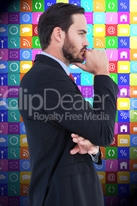 Composite image of thinking businessman standing with hand on ch