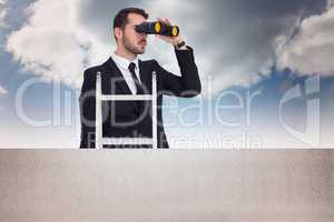 Composite image of businessman looking on a ladder