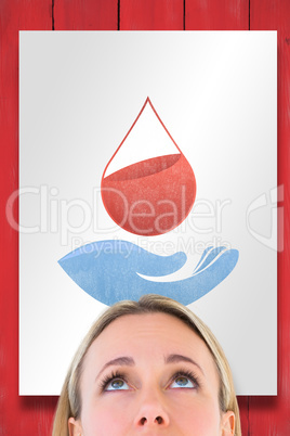 Composite image of close up of blonde woman looking up