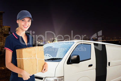 Composite image of happy delivery woman holding cardboard box